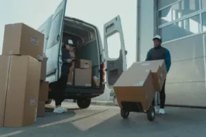 Man moving boxes into van